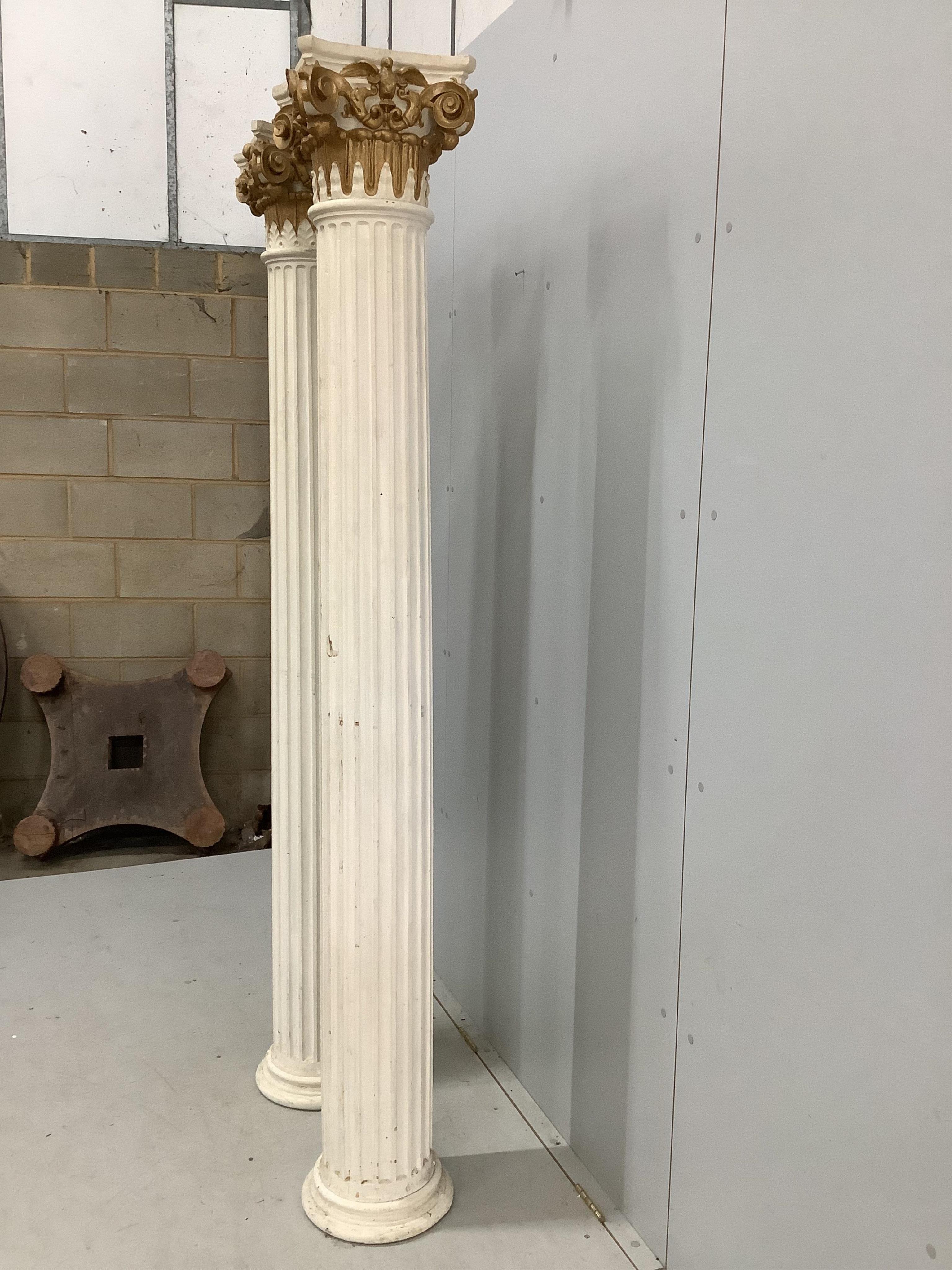 A pair of painted wooden Corinthian columns, height 205cm